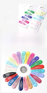 Macro detail of colorful metal snap hair clips in candy colors showing high elasticity