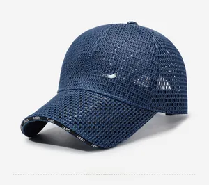 Detail of dark blue mesh baseball cap with white FARD embroidery and breathable texture