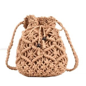 Handmade hollow macrame crossbody bag in beige cotton cord with wooden bead accents