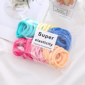 Macro shot of 50-pack high elastic seamless hair ties in vibrant multicolor set