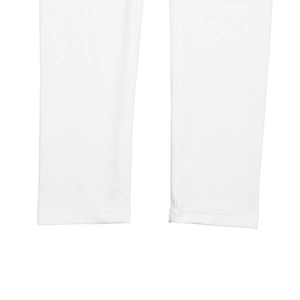Detailed view of white flared pants leg with professional stitching and cotton fabric