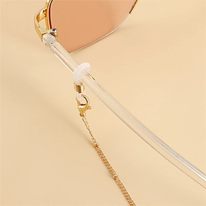 Detail of gold metal glasses chain with lobster clasp and clear silicone loop attachment