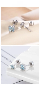 Macro detail of screw-back earrings featuring light blue zircon flowers in silver