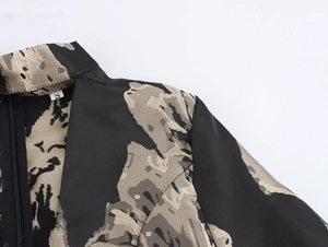 Close-up of V-neckline with jacquard fabric texture and size S label detail