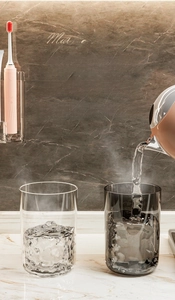Close-up of thick PET bathroom cups in clear and grey, heat resistant and BPA-free