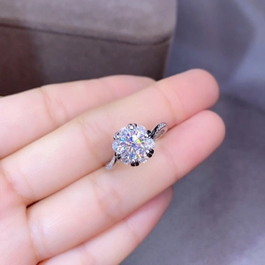 Macro detail of silver floral cluster ring with sparkling round cubic zirconia stones