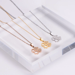 Three-color clover pendant necklaces with sparkling zircon and heart-shaped hollow design