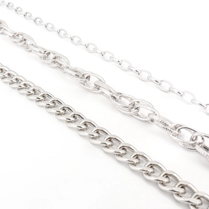 Detailed comparison of three industrial silver metal chains with different link textures