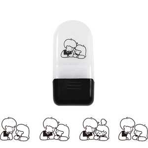 Detail showing cartoon couple roller stamp with black ink imprint on white background