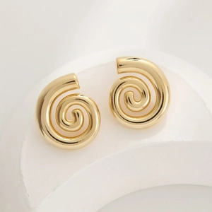 Minimalist gold-plated geometric spiral earrings on a modern white stone display