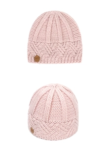Close-up detail of pink knit beanie with chunky diamond pattern and brown leather label