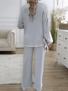 Back view of gray knit two-piece set featuring long-sleeve top and wide-leg lounge pants
