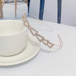 Elegant rose gold rhinestone headband with geometric interlocking chain design for women