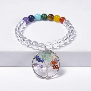 Detailed shot of chakra crystal beaded bracelet with a Tree of Life wire-wrapped pendant
