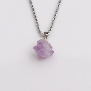 Irregular raw purple amethyst crystal pendant on silver twisted chain necklace