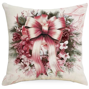 Christmas pillow cover with pink ribbon wreath, pine needles and pine cones on beige fabric