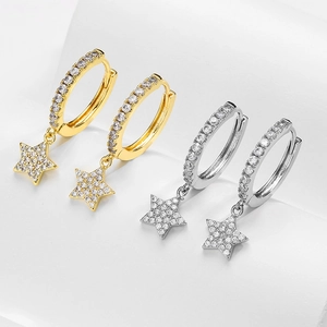 Detail of gold and silver star charm hoop earrings with micro-paved cubic zirconia crystals