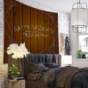 Detail of Halloween tapestry with spider web pattern on dark wood texture wall hanging