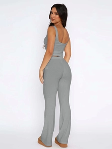 Detail view of gray two-piece set featuring a sleeveless crop top and high-waisted pants