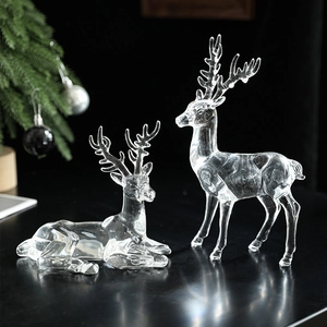 Elegant pair of clear acrylic Christmas reindeer figurines in standing and sitting poses