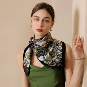 French vintage tropical print silk scarf styled with green satin top and gold jewelry