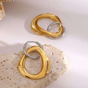 Modern minimalist geometric earrings featuring gold and silver interlocking rings
