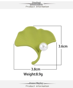 Detail showing elegant green ginkgo leaf brooch with pearl and dimensions 3.8cm x 3.6cm