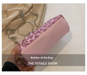 Detailed view of the pink sequined evening bag base with silver metal chain strap