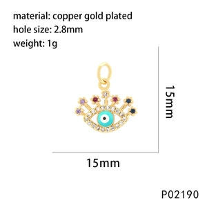 Macro view of a 15mm evil eye shell pendant with colorful rhinestones and gold plating