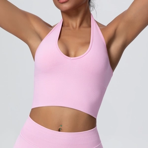 Close-up of pink halter-neck sports bra and seamless knit leggings yoga set outfit