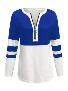 Detail of color block blue and white sweatshirt with V-neck zipper and striped sleeves