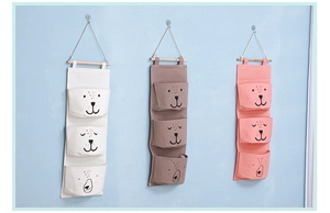 Three-tier wall hanging storage bags in cotton linen with cute cartoon animal faces