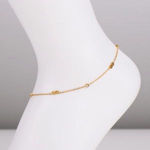 Gold stainless steel infinity anklet featuring clear rhinestones on a mannequin ankle