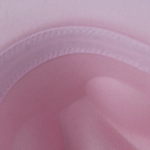 Close-up of sweatband area with precision single-needle stitching on pink wool felt hat