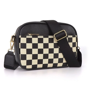 Black checkered camera bag with wide nylon strap and gold hardware in crossbody style
