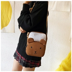 Detail of the brown bear-shaped crossbody bag with soft fabric and 3D ears