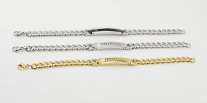 Detailansicht der Gliederketten-Armbänder in Silber, Gold und Schwarz für Herren