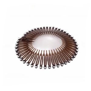 Close-up of brown stretch hair comb featuring sparkling rhinestone embellishments