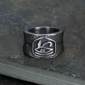 Eye of Horus polished stainless steel ring with hammered texture on grey stone