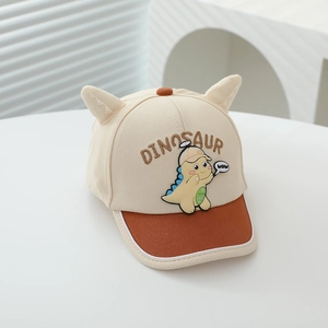 Close-up of kids dinosaur baseball cap with 3D ears and embroidered letter patch