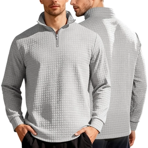 Detailed view of grey men's sweatshirt with waffle knit texture and half-zip collar
