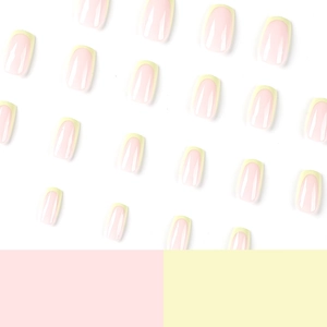 Minimalist French press-on nails in soft pink with light yellow tips on white background