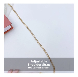 Detail of adjustable gold metal chain strap on a quilted PVC jelly bag for kids