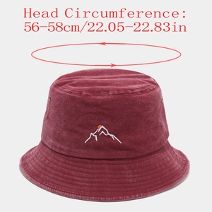 Close-up of burgundy washed cotton bucket hat with mountain sunset embroidery detail