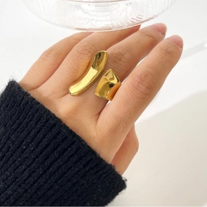Polished 18K gold titanium steel open ring with a minimalist bold irregular design