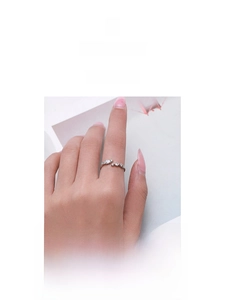 Detail of adjustable S925 silver ring featuring sparkling inlaid zircon stones for women