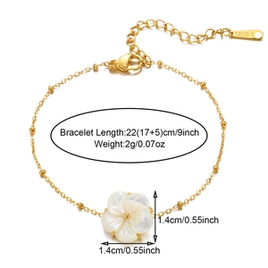 Detail view of 18k gold plated bracelet showing 22cm adjustable length and shell flower charm