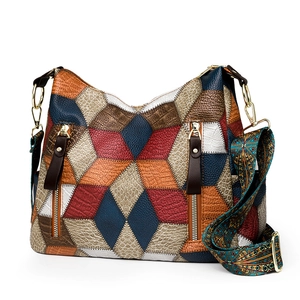 Colorful geometric patchwork leather tote bag with patterned strap and fringe details