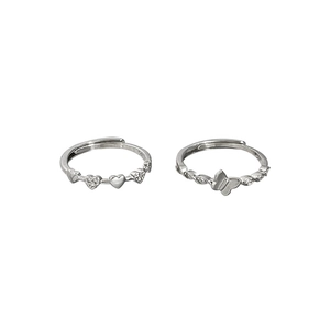 Silver rings with micro-set zircon heart and butterfly designs on white background