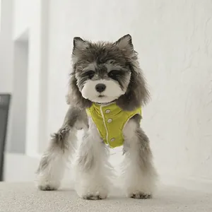 Warm yellow corduroy dog vest with white fleece trim and metallic snaps for small pets